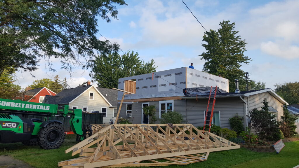 Second story addition framed with room gables on the ground